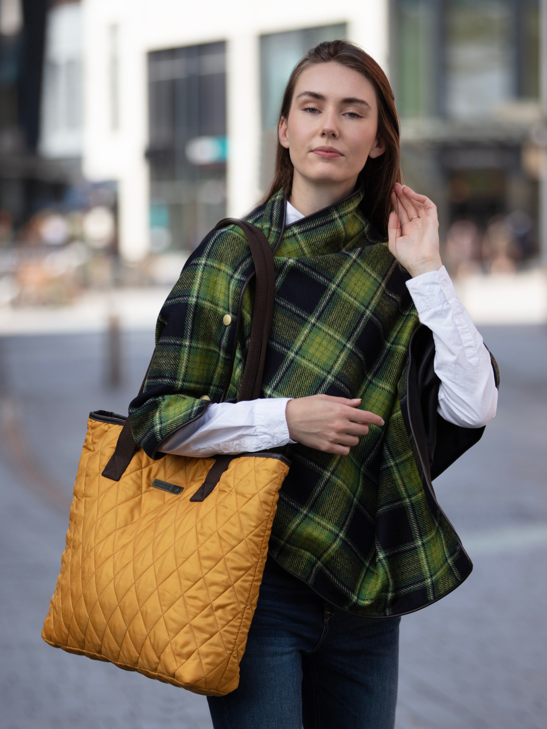 Green and black tartan tweed shawl with black satin lining, gold studs, and faux leather trim, handcrafted in the UK by John Partridge.