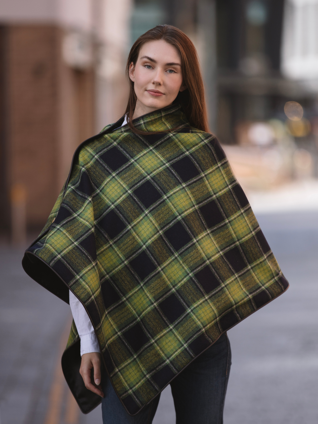 Green and black tartan tweed shawl with black satin lining, gold studs, and faux leather trim, handcrafted in the UK by John Partridge.