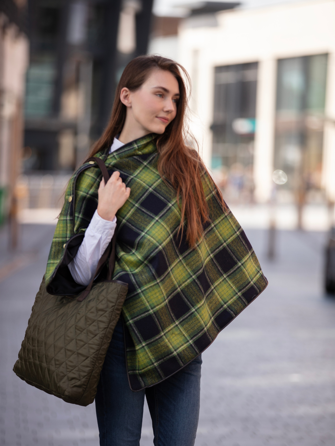Green and black tartan tweed shawl with black satin lining, gold studs, and faux leather trim, handcrafted in the UK by John Partridge.