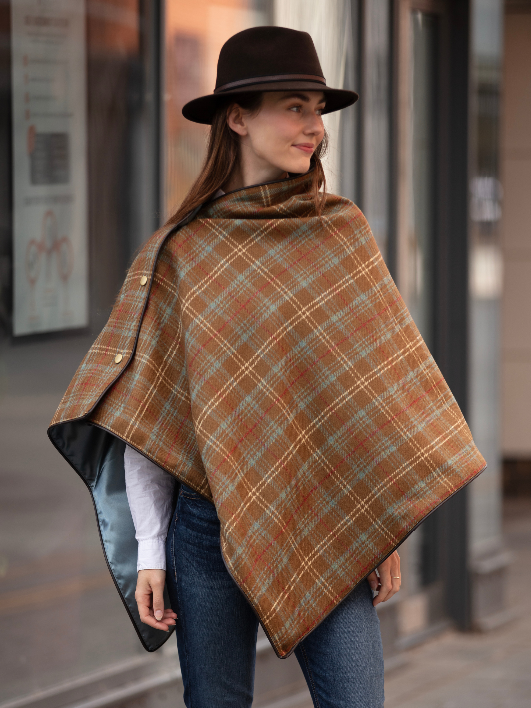 Brown, blue and cream tartan tweed shawl with black satin lining, gold studs, and faux leather trim, handcrafted in the UK by John Partridge