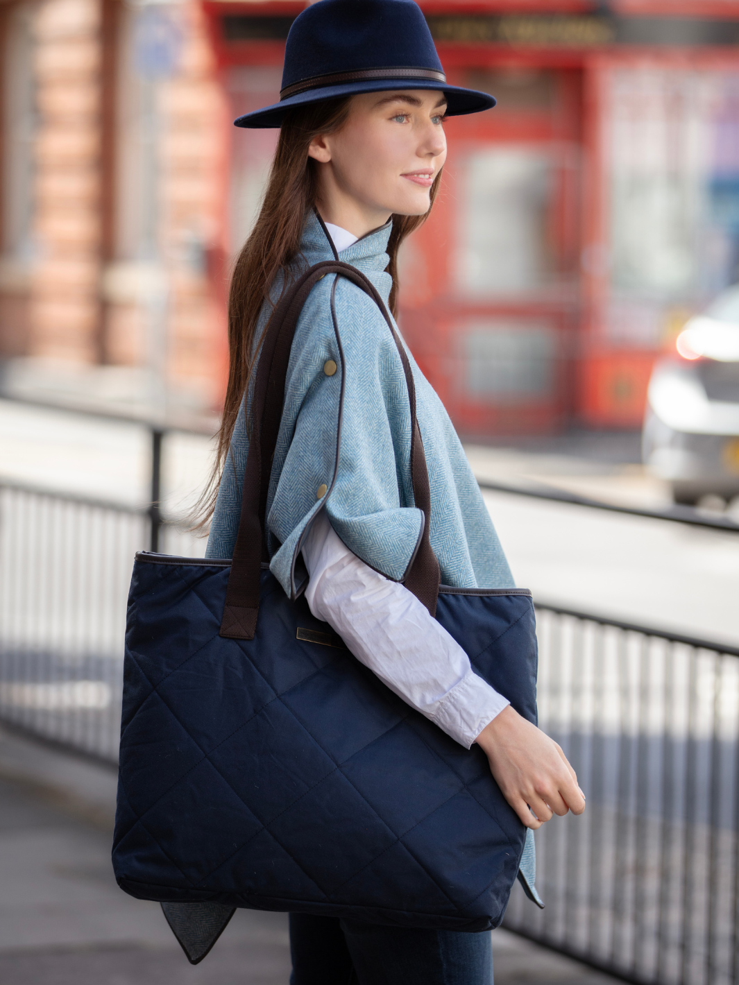 John Partridge & Co. Oversized Tote Bag in navy with herringbone straps, leather-look binding, antique brass plate, and spacious interior, expertly crafted in England.