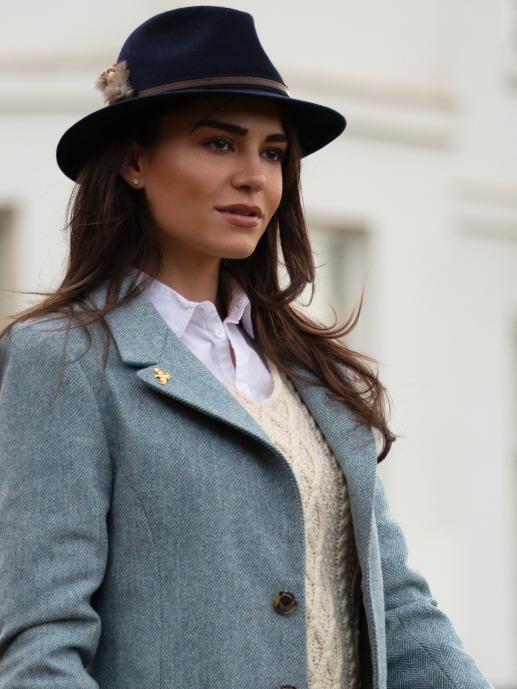 Pastel blue herringbone tweed coat with bright blue velvet cuffs and collar, knee-length, made in the UK by John Partridge.