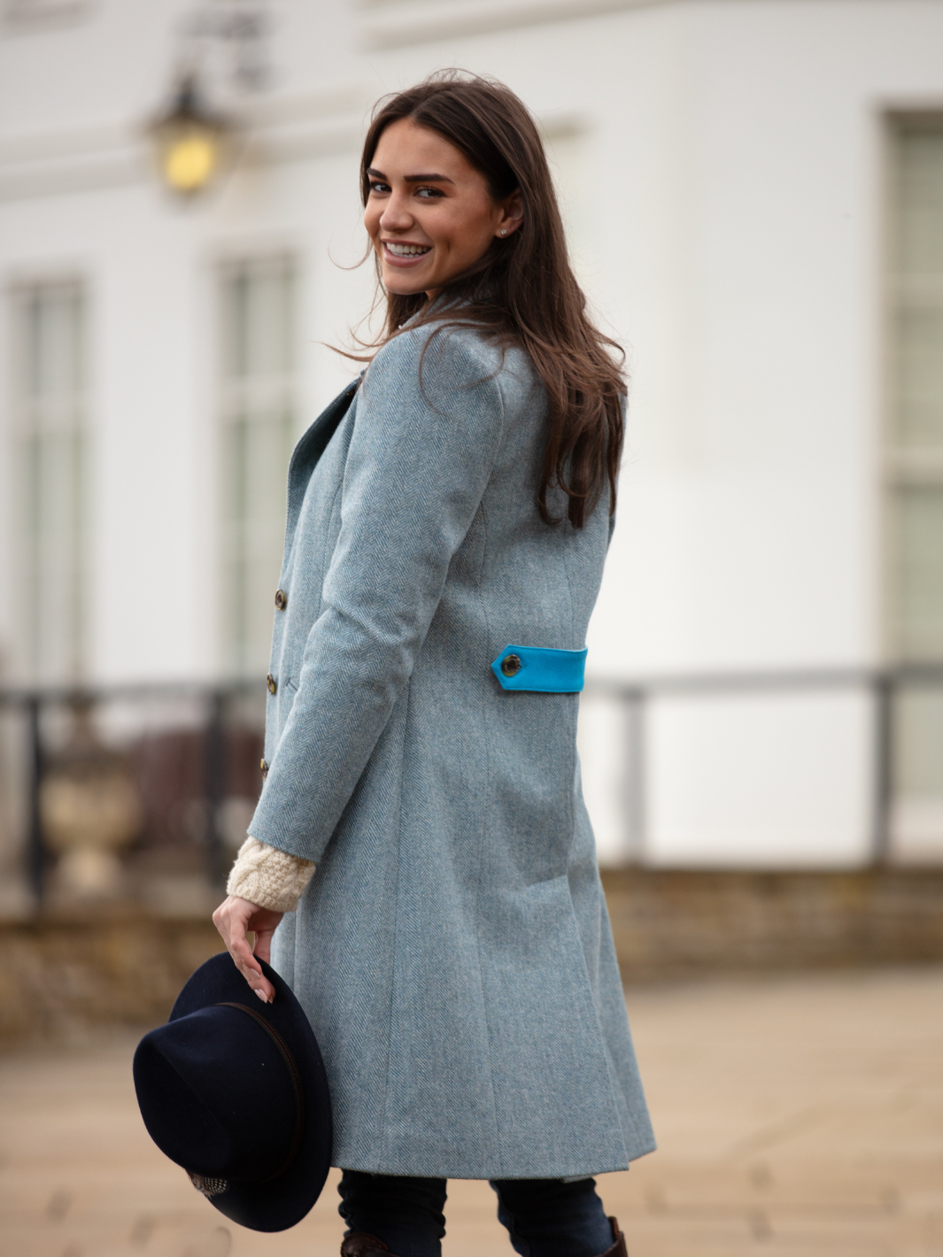 Pastel blue herringbone tweed coat with bright blue velvet cuffs and collar, knee-length, made in the UK by John Partridge.
