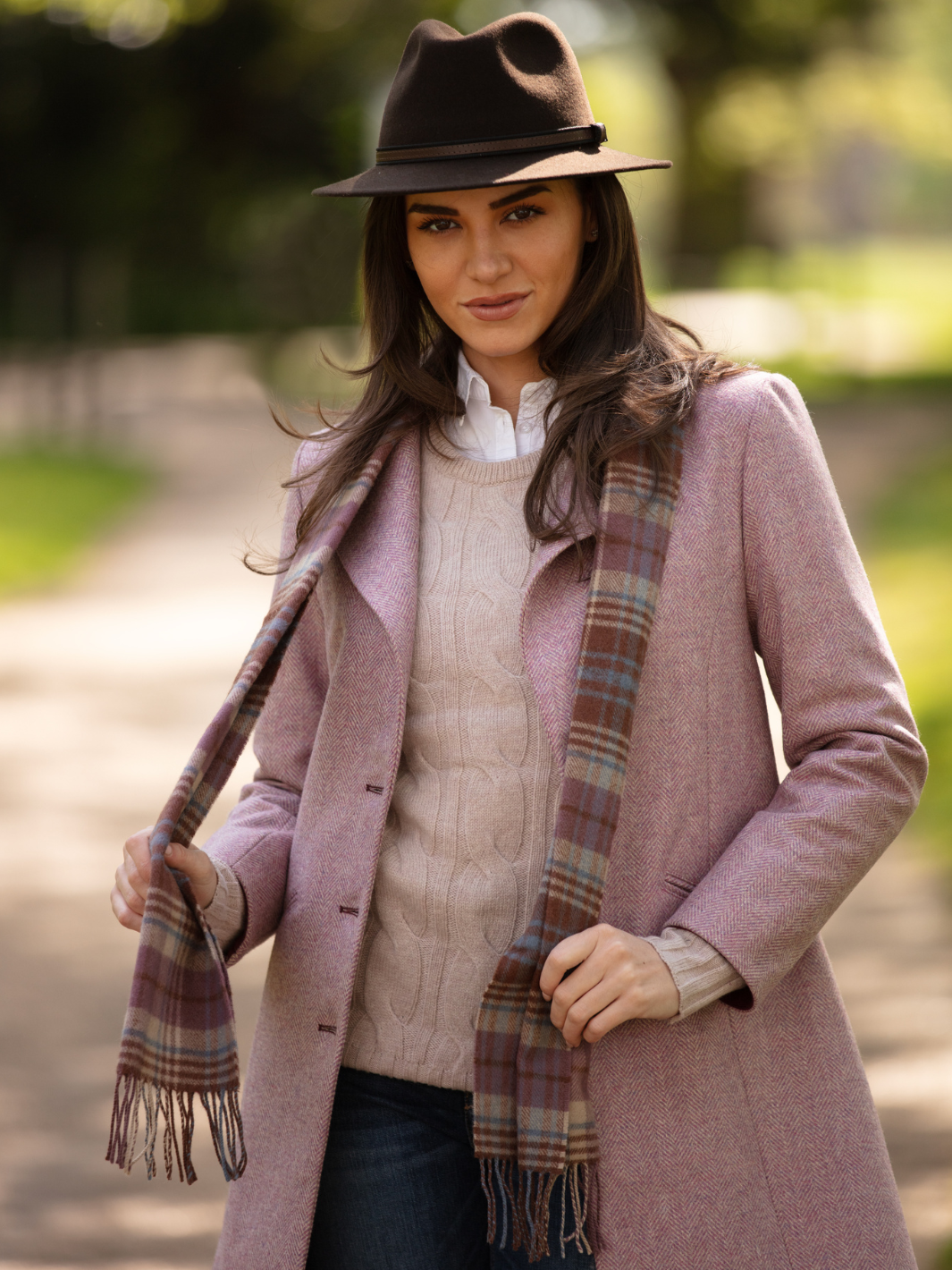 Pastel pink herringbone tweed coat with bright pink velvet cuffs and collar, knee-length, made in the UK by John Partridge.