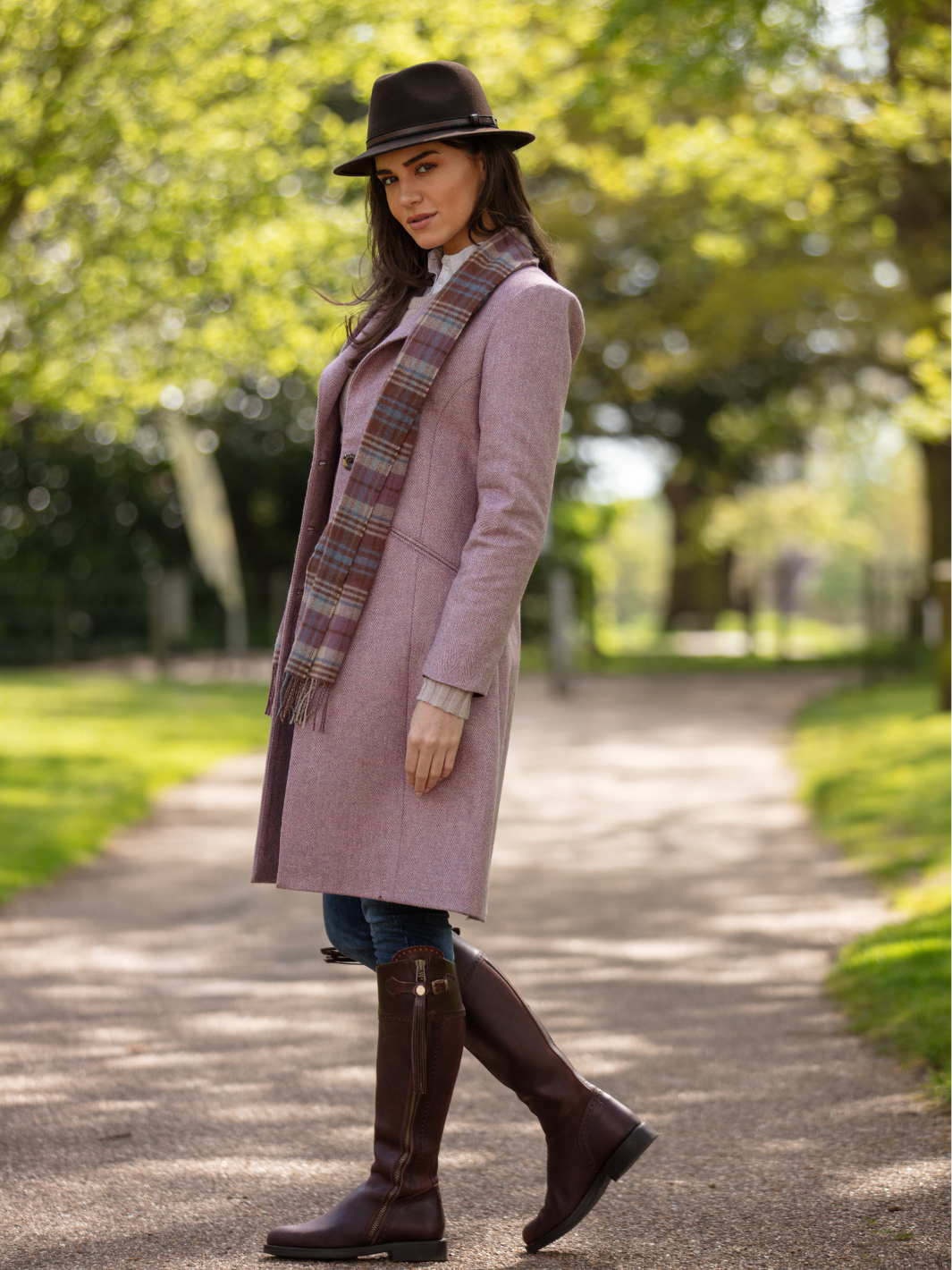 Pastel pink herringbone tweed coat with bright pink velvet cuffs and collar, knee-length, made in the UK by John Partridge.