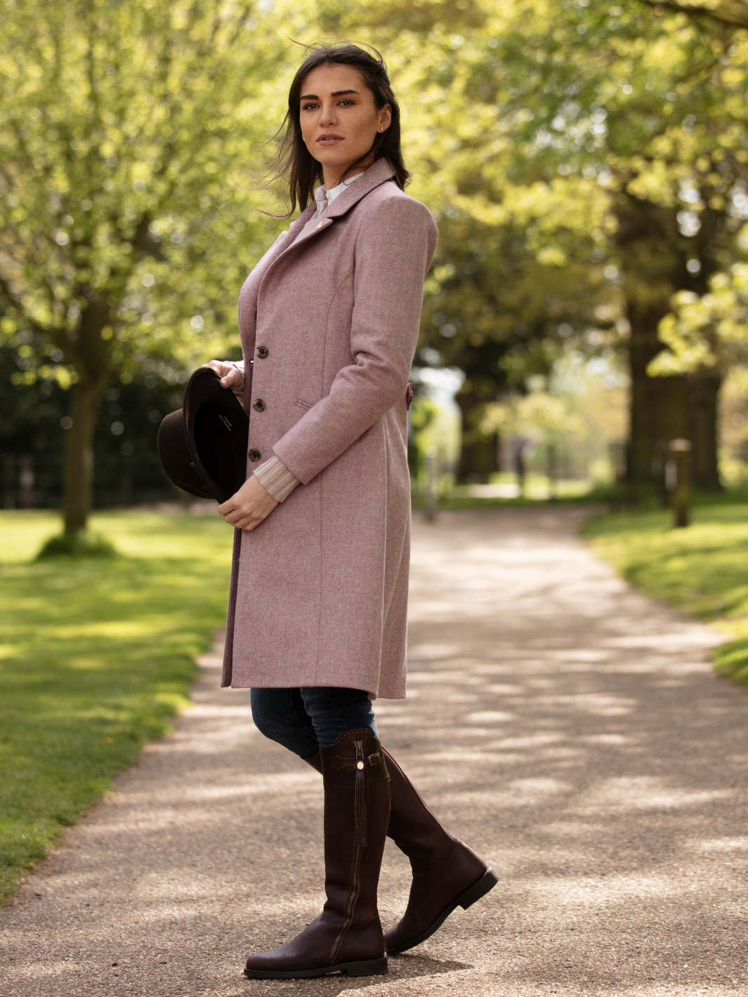 Pastel pink herringbone tweed coat with bright pink velvet cuffs and collar, knee-length, made in the UK by John Partridge.
