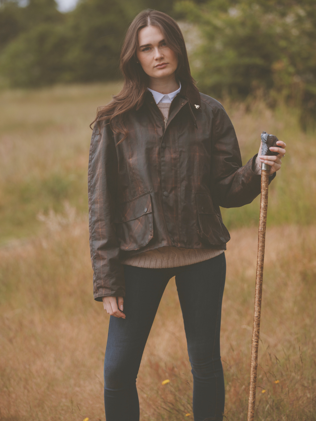 Landowner Short Wax Walking Jacket in Hunter Check with warm brown tones. A unisex, boxy-shaped waxed cotton jacket featuring cord and moleskin details for timeless elegance and weather protection, perfect for outdoor adventures or everyday wear.
