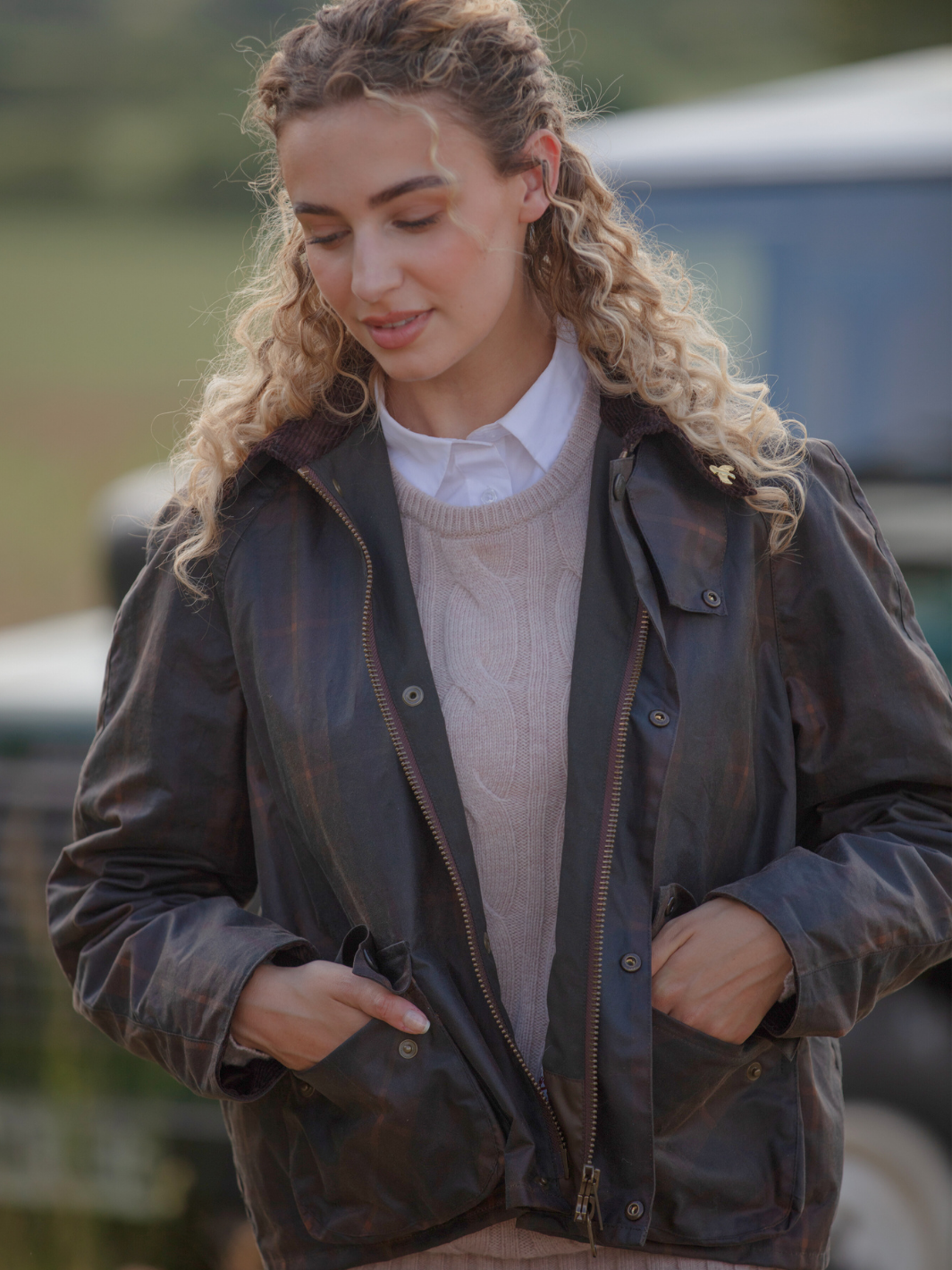 Landowner Short Wax Walking Jacket in Hunter Check with warm brown tones. A unisex, boxy-shaped waxed cotton jacket featuring cord and moleskin details for timeless elegance and weather protection, perfect for outdoor adventures or everyday wear.