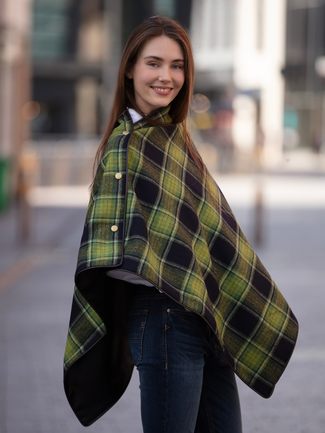 Green and black tartan tweed shawl with black satin lining, gold studs, and faux leather trim, handcrafted in the UK by John Partridge.