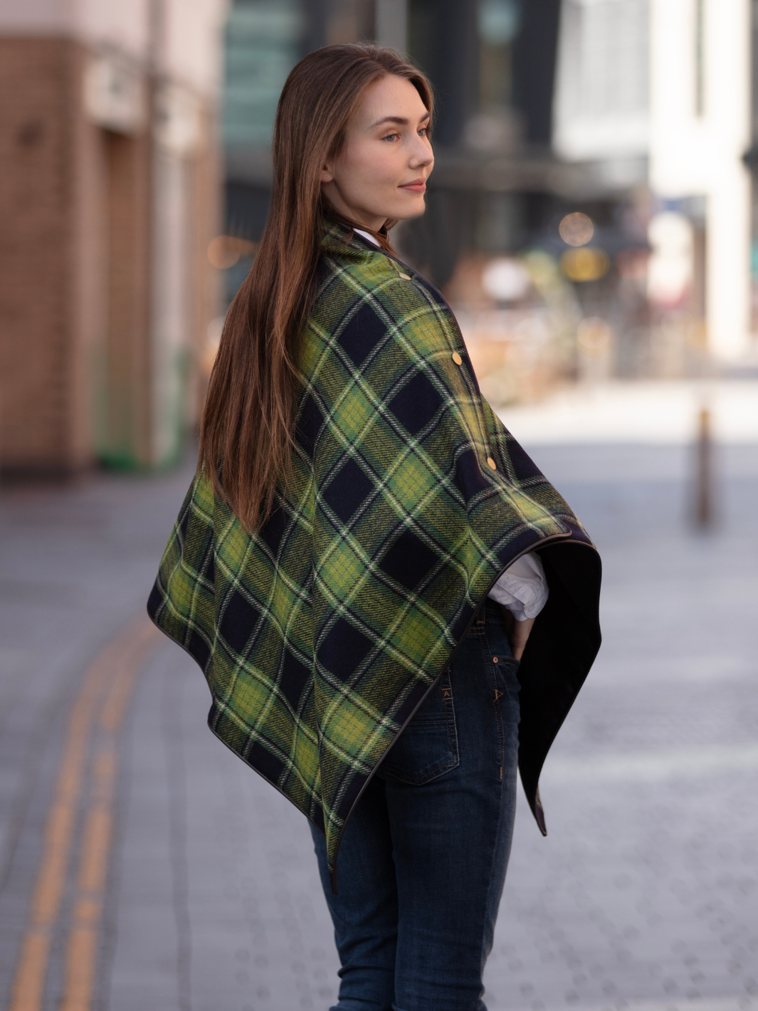 Green and black tartan tweed shawl with black satin lining, gold studs, and faux leather trim, handcrafted in the UK by John Partridge.