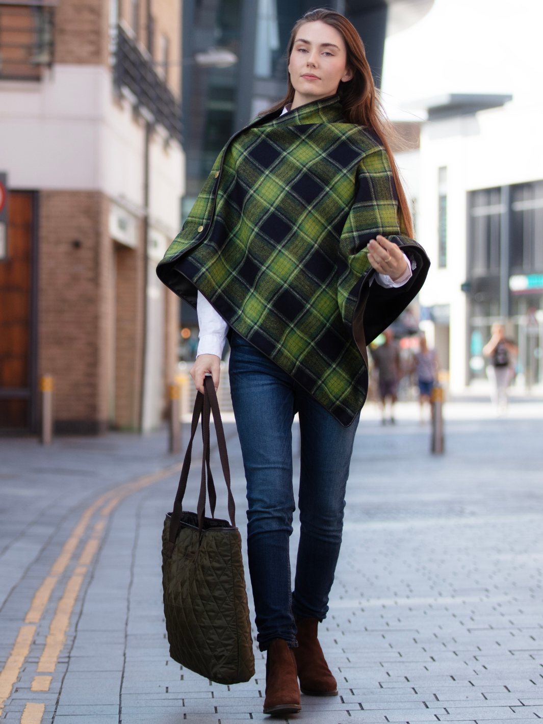 Green and black tartan tweed shawl with black satin lining, gold studs, and faux leather trim, handcrafted in the UK by John Partridge.