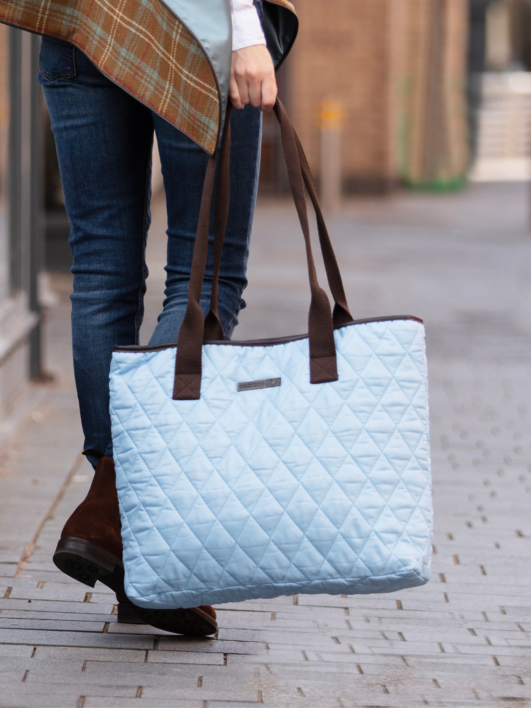 John Partridge & Co. Oversized Tote Bag in baby blue with herringbone straps, leather-look binding, antique brass plate, and spacious interior, expertly crafted in England.