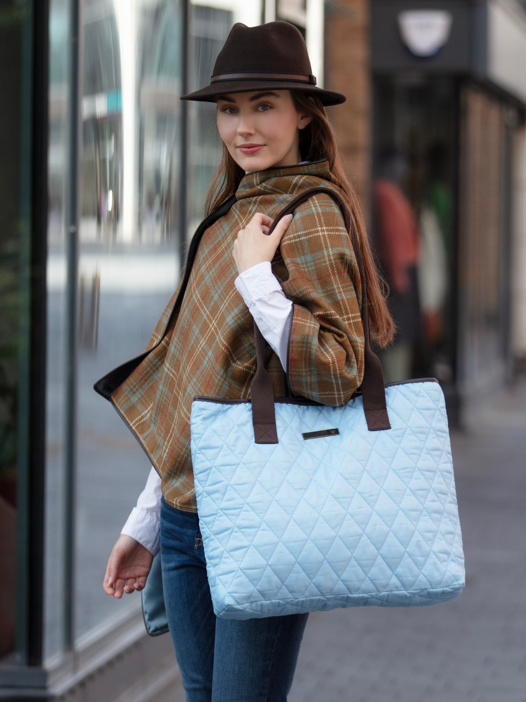 John Partridge & Co. Oversized Tote Bag in baby blue with herringbone straps, leather-look binding, antique brass plate, and spacious interior, expertly crafted in England.