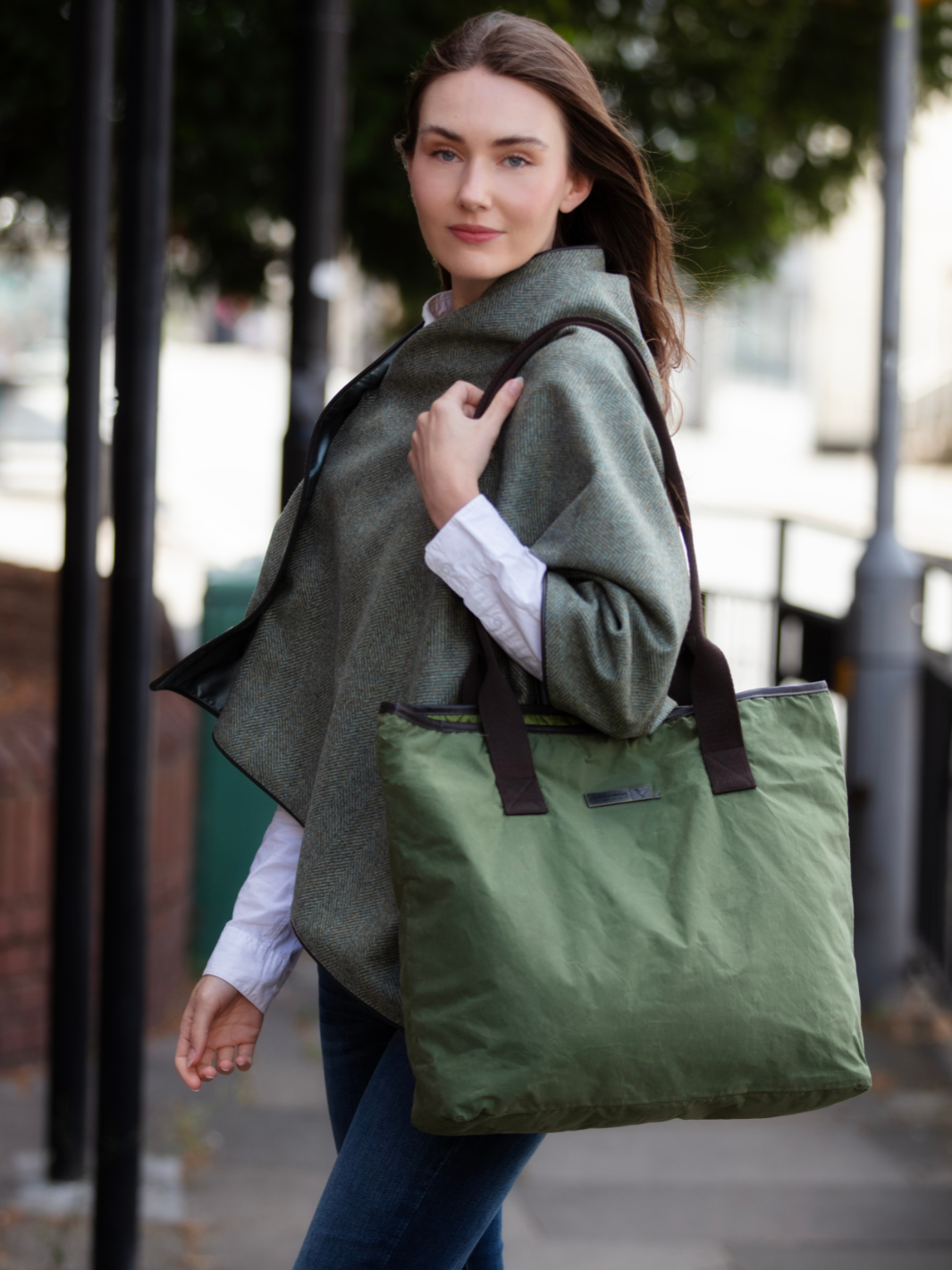 John Partridge & Co. Oversized Tote Bag in green with herringbone straps, leather-look binding, antique brass plate, and spacious interior, expertly crafted in England.