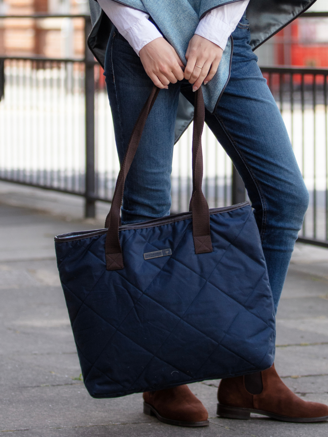 John Partridge & Co. Oversized Tote Bag in navy with herringbone straps, leather-look binding, antique brass plate, and spacious interior, expertly crafted in England.