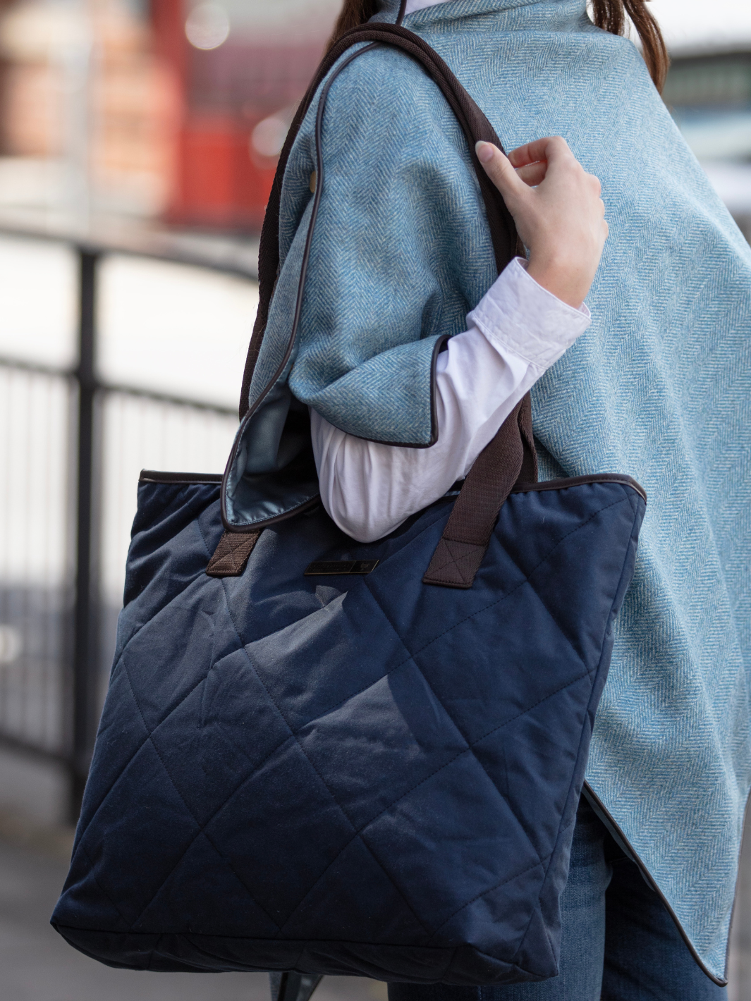 John Partridge & Co. Oversized Tote Bag in navy with herringbone straps, leather-look binding, antique brass plate, and spacious interior, expertly crafted in England.