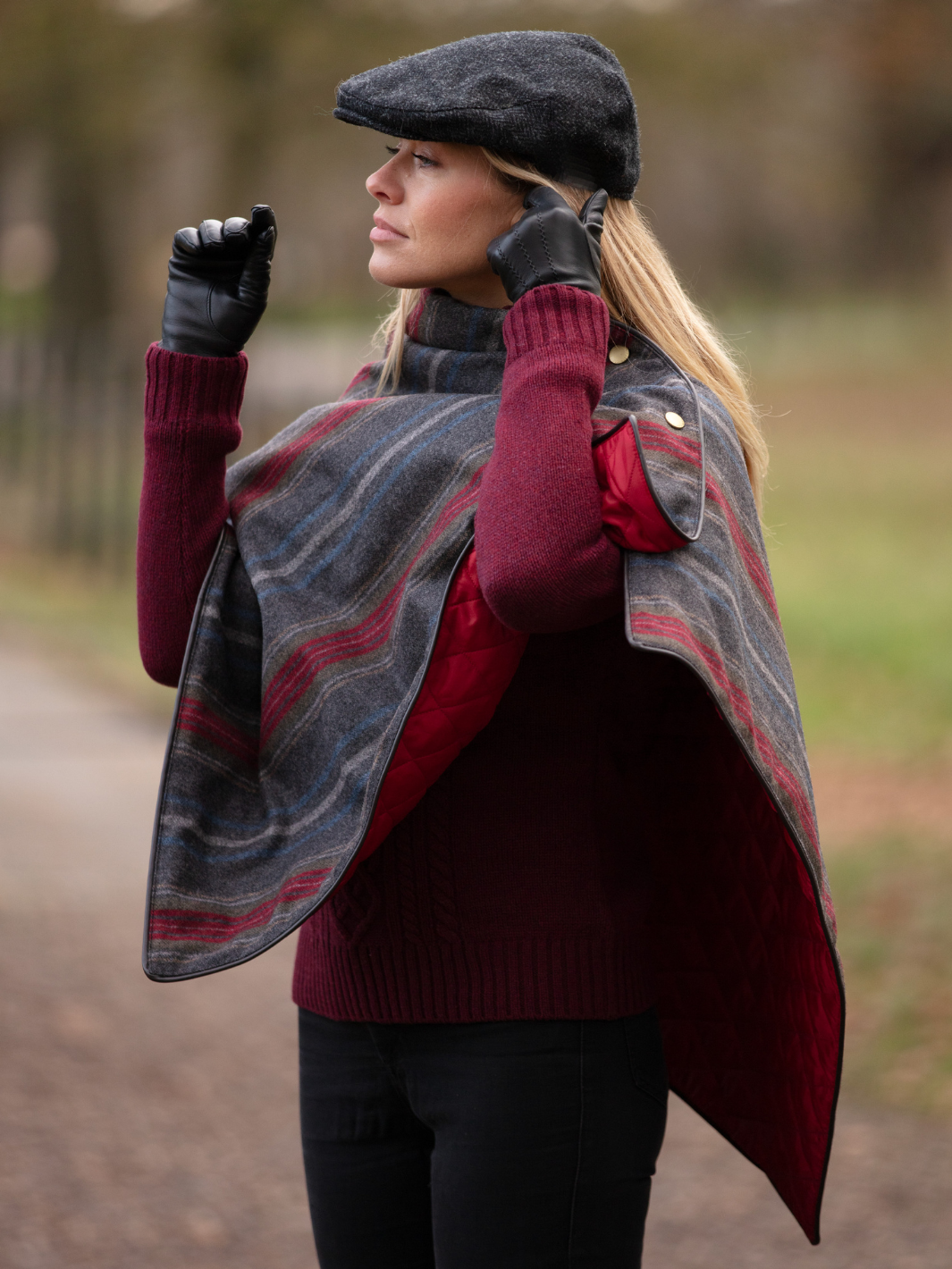 Made in England Tweed Shawl | Women’s striped wool shawl in dark grey with red quilted lining, brown leather-look trim and gold fastenings