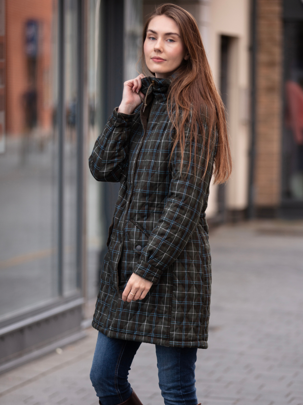 Newmarket Quilted Hooded Coat in Olive Check with adjustable waist and hood, olive corduroy trims, satin lining, 2-way zip, and practical pockets, crafted in Britain.