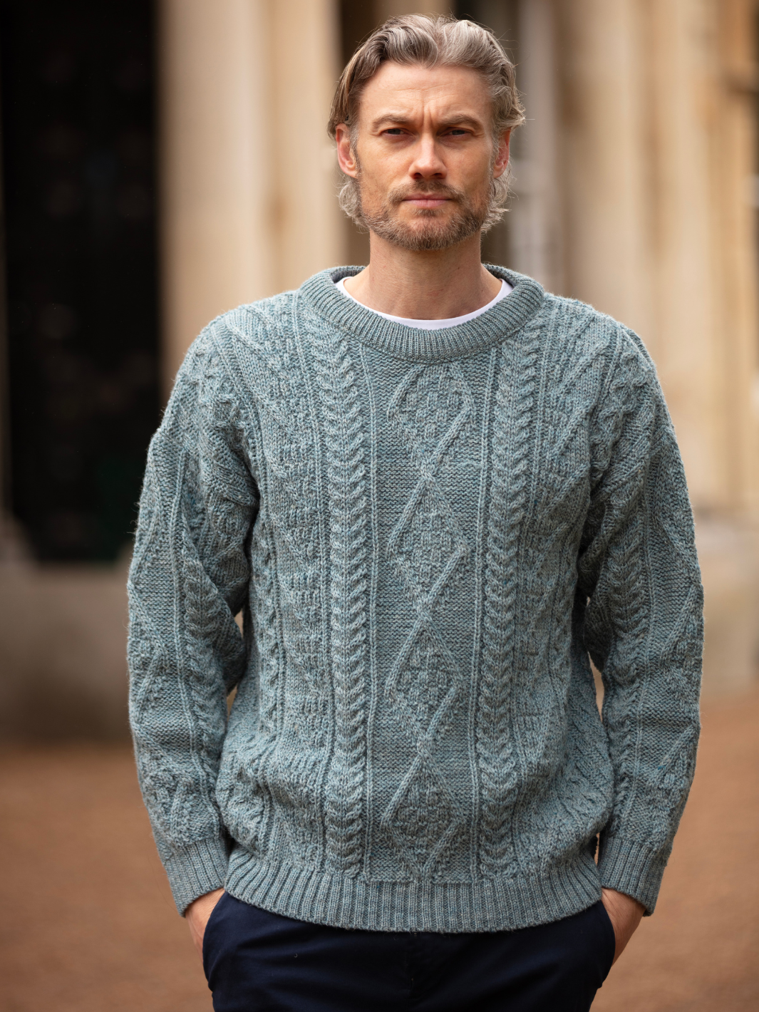 Partridge Unisex Aran Wool Jumper - Seafoam | Men’s model wearing a breathable British wool jumper with classic textured stitching