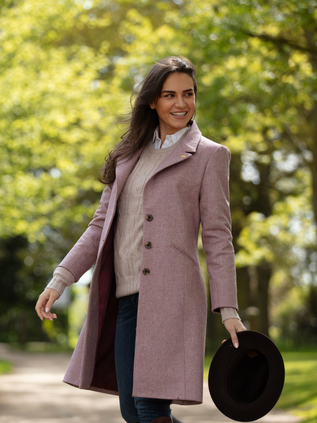 Pastel pink herringbone tweed coat with bright pink velvet cuffs and collar, knee-length, made in the UK by John Partridge.
