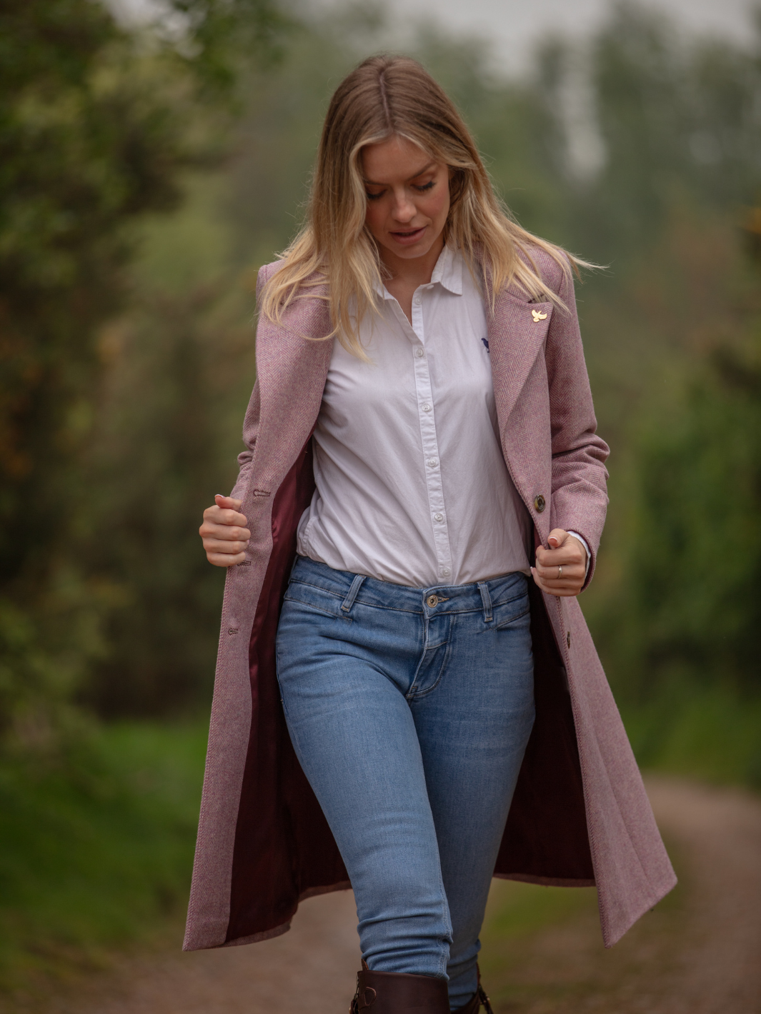 Pastel pink herringbone tweed coat with bright pink velvet cuffs and collar, knee-length, made in the UK by John Partridge.
