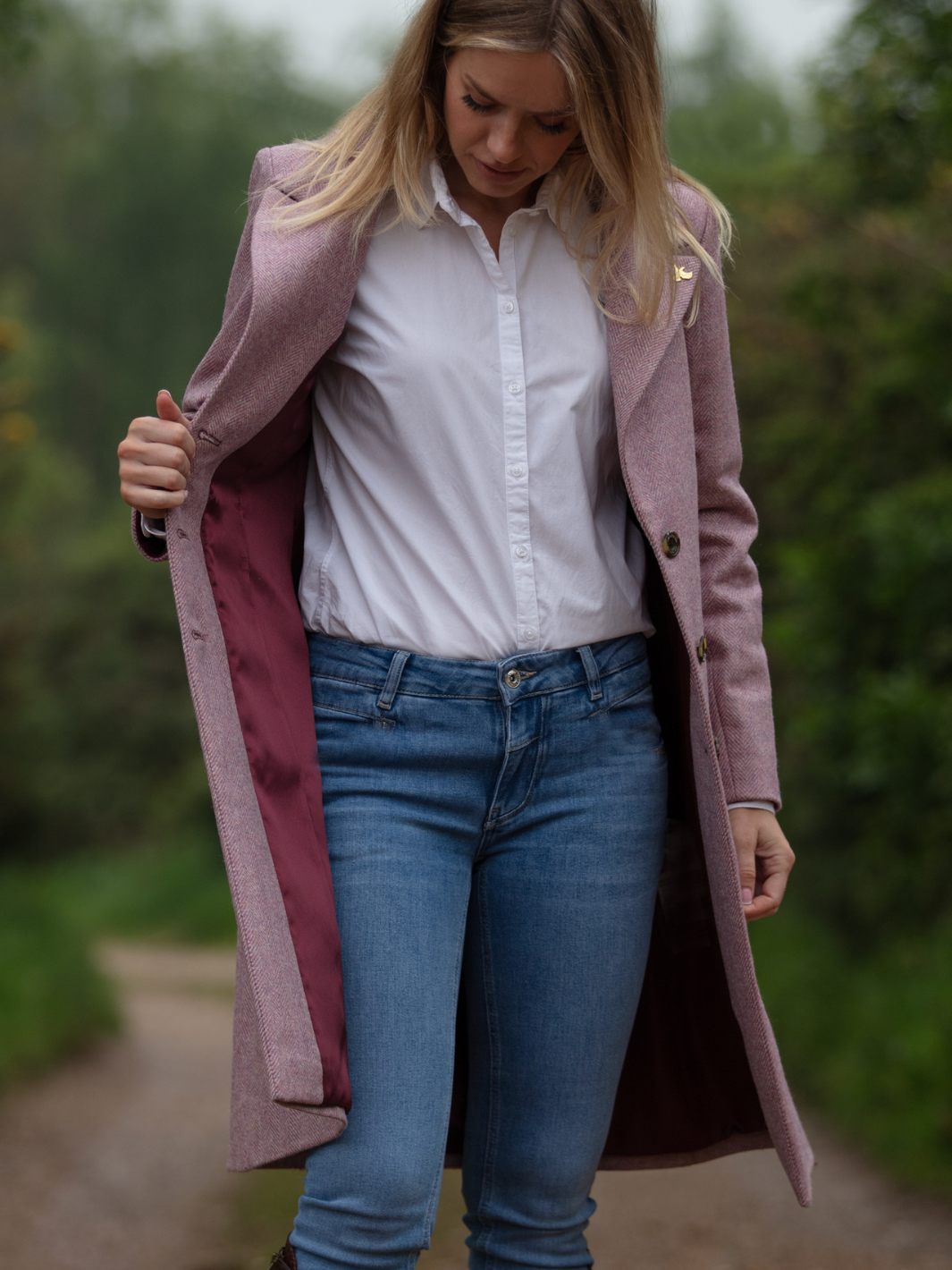 Pastel pink herringbone tweed coat with bright pink velvet cuffs and collar, knee-length, made in the UK by John Partridge.
