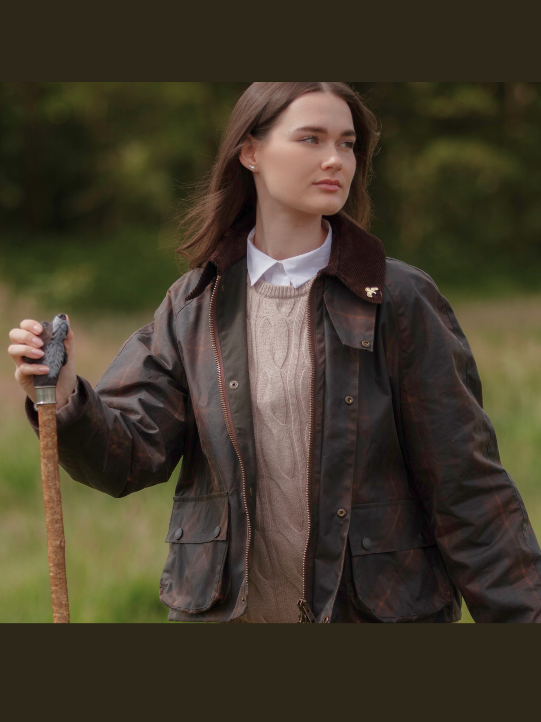 Landowner Short Wax Walking Jacket in Hunter Check with warm brown tones. A unisex, boxy-shaped waxed cotton jacket featuring cord and moleskin details for timeless elegance and weather protection, perfect for outdoor adventures or everyday wear.