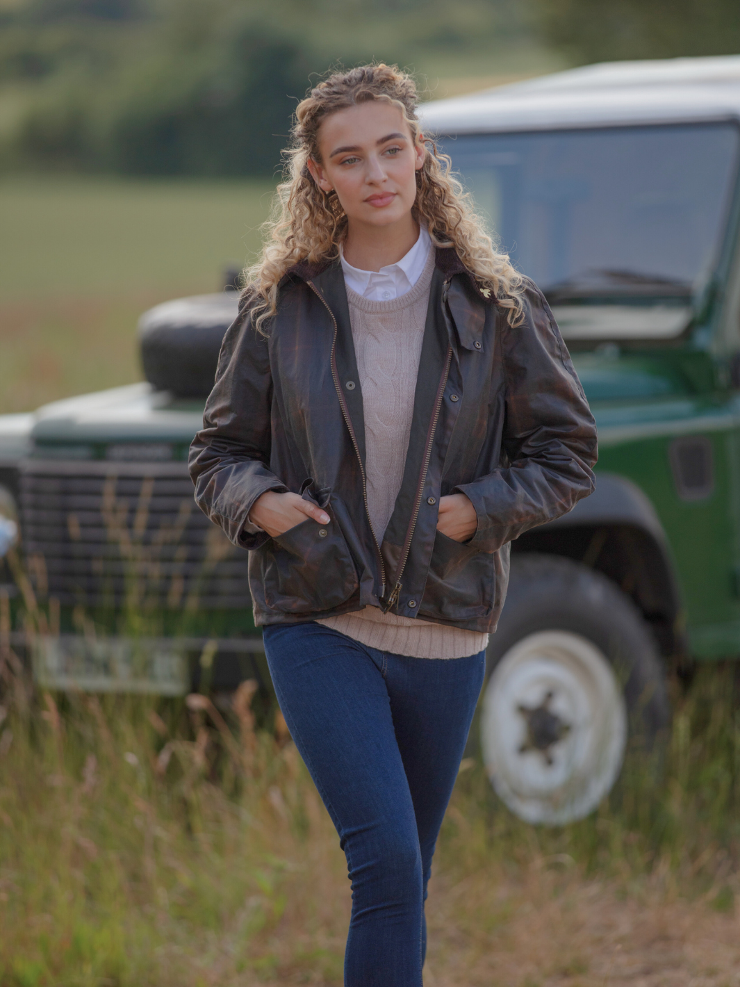 Landowner Short Wax Walking Jacket in Hunter Check with warm brown tones. A unisex, boxy-shaped waxed cotton jacket featuring cord and moleskin details for timeless elegance and weather protection, perfect for outdoor adventures or everyday wear.