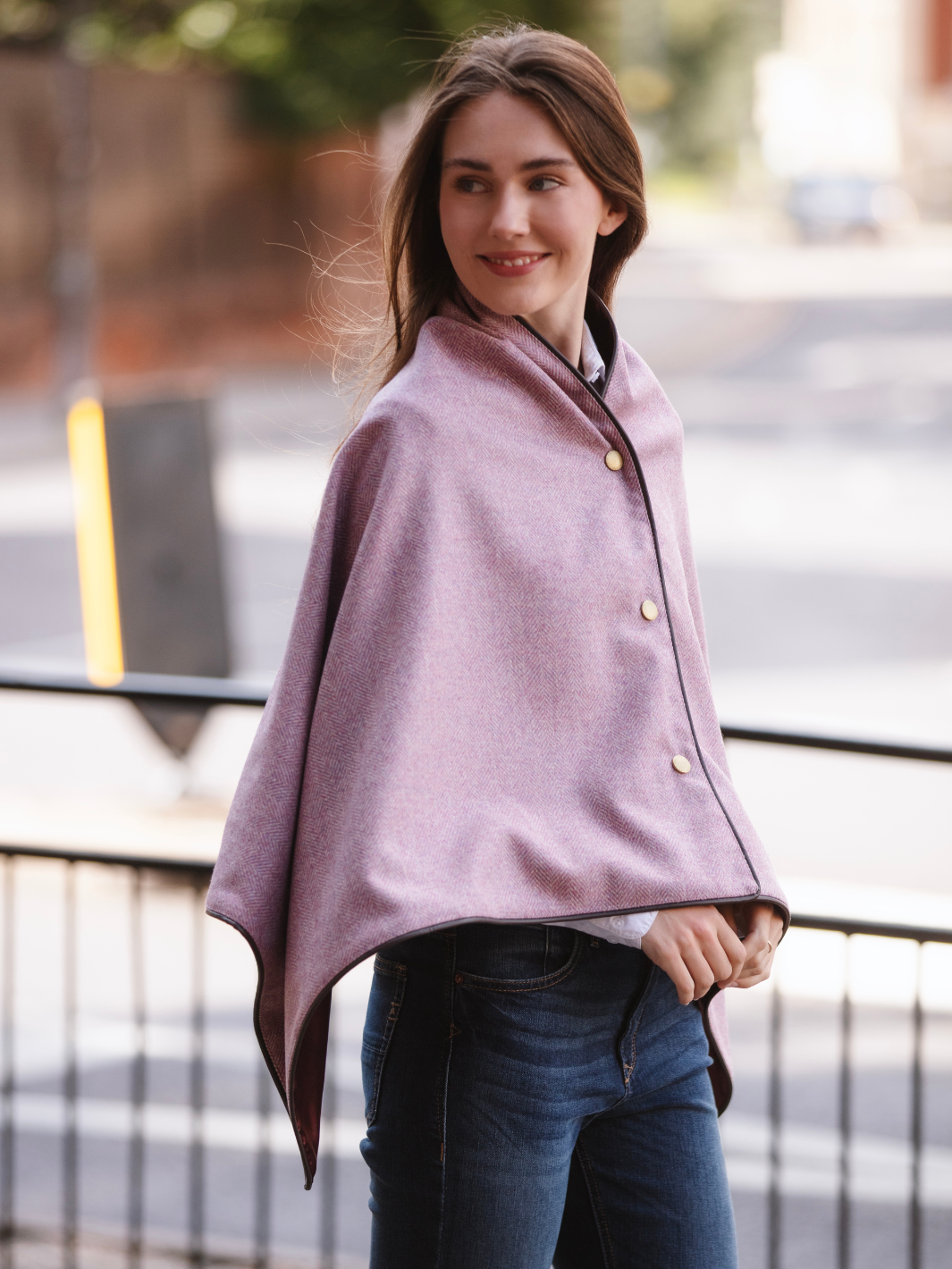 Soft pink herringbone tweed shawl with burgundy satin lining, gold studs, and dark brown faux leather trim, made in the UK by John Partridge.